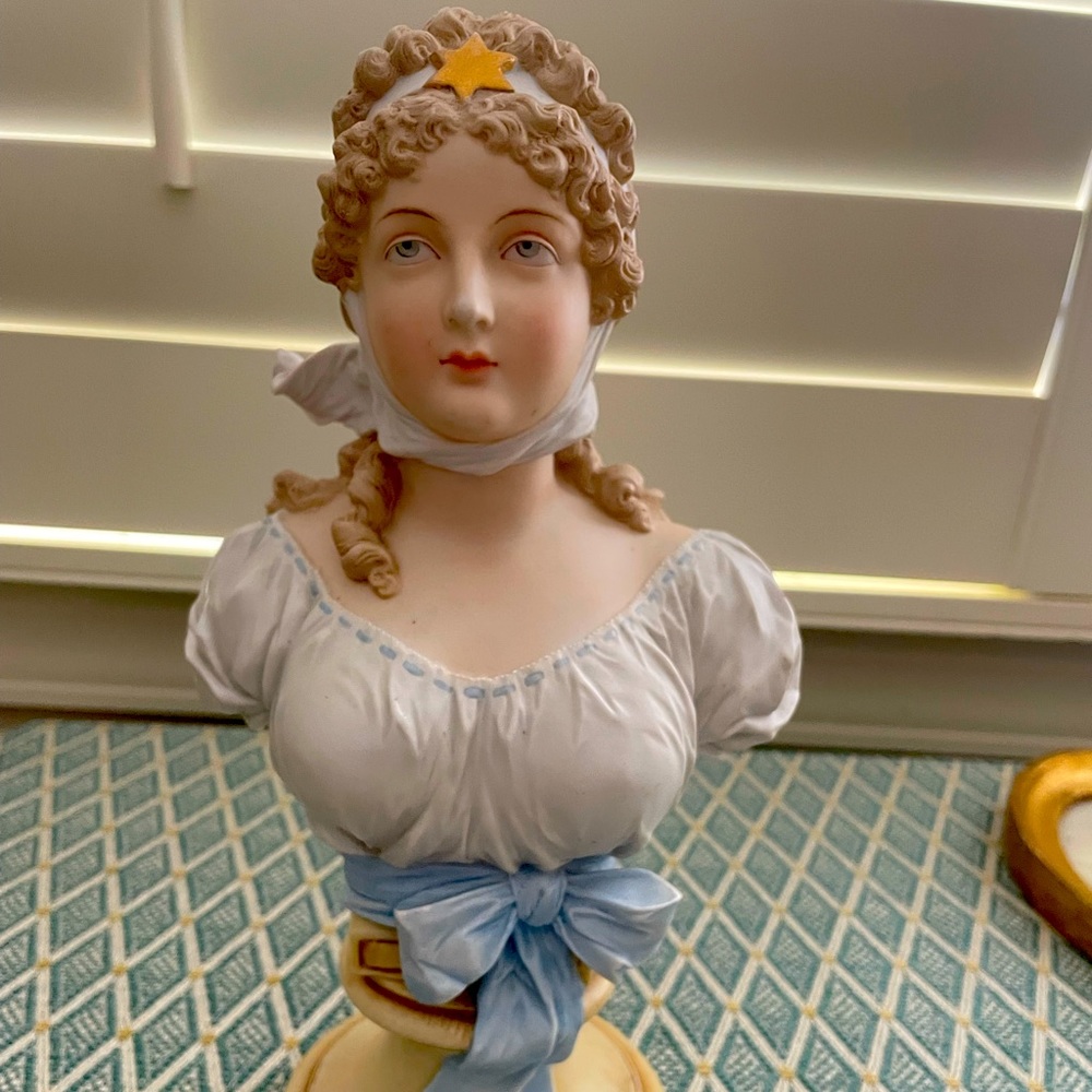Porcelain girl bust with blue ribbon